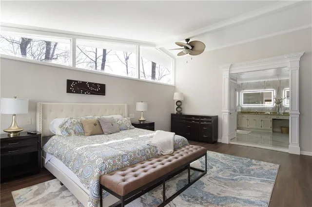 a bedroom with a bed and dresser