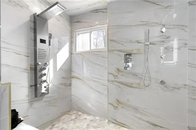 a bedroom with a bed window and a table