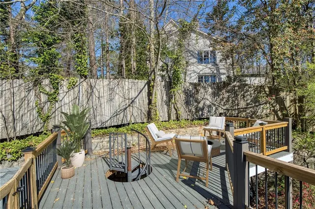 a view of balcony with wooden floor and outdoor seating