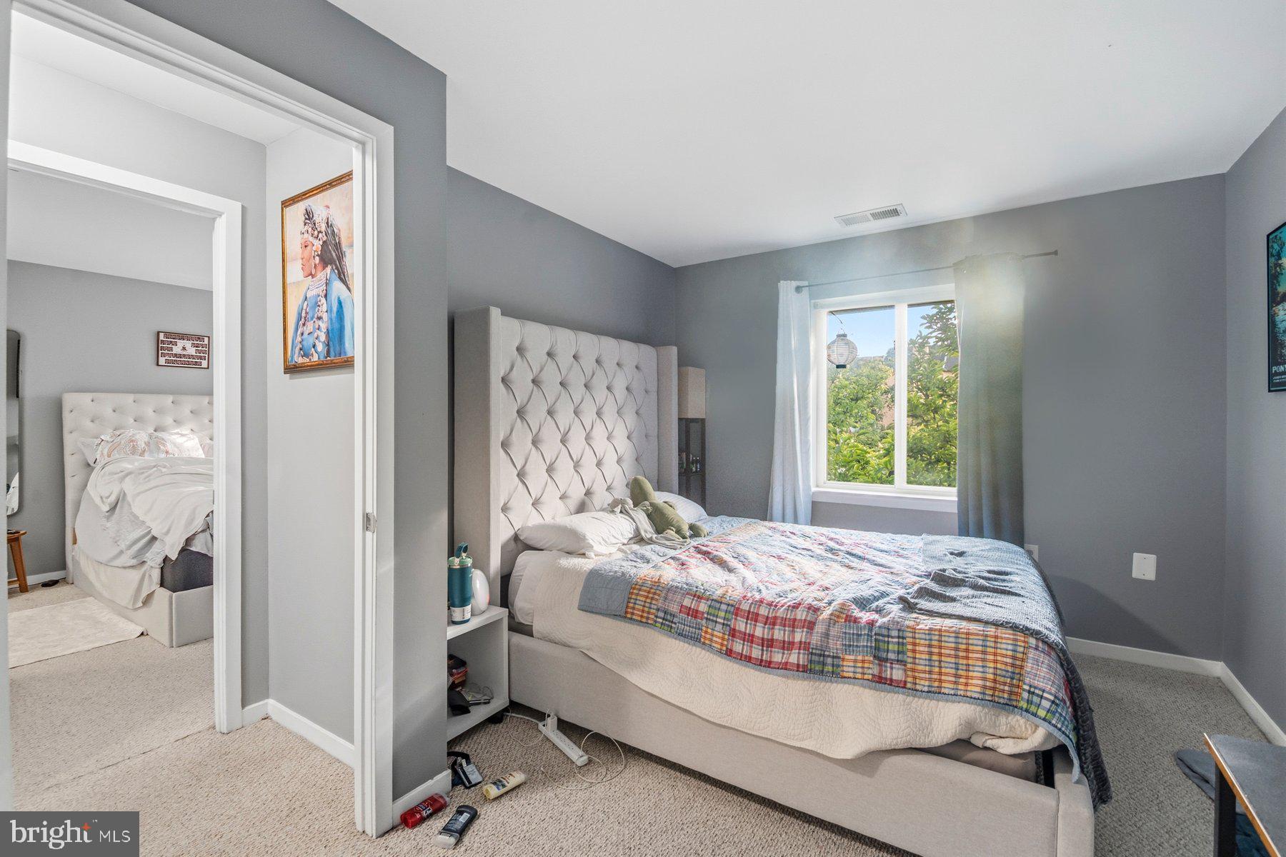 642 South Charles Street, Unit R 22 Baltimore, MD 21230 - Photo 17 of 26 a bedroom with a bed and a window