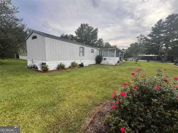 a view of a backyard with garden