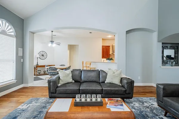 a living room with furniture rug and window