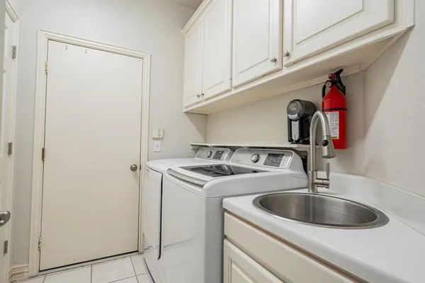 a close view of a sink and dishwasher in a kitchen