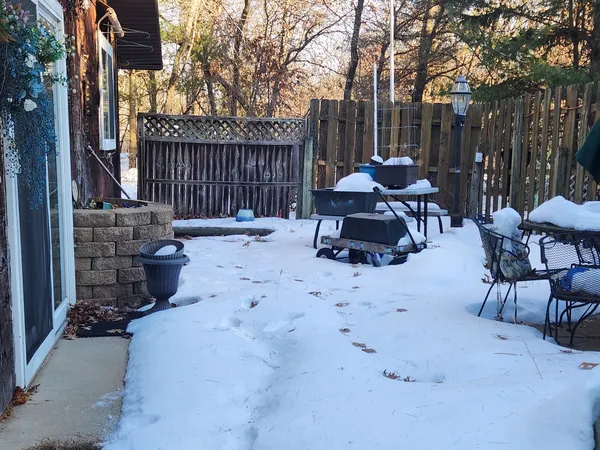 a view of backyard with furniture and outdoor seating