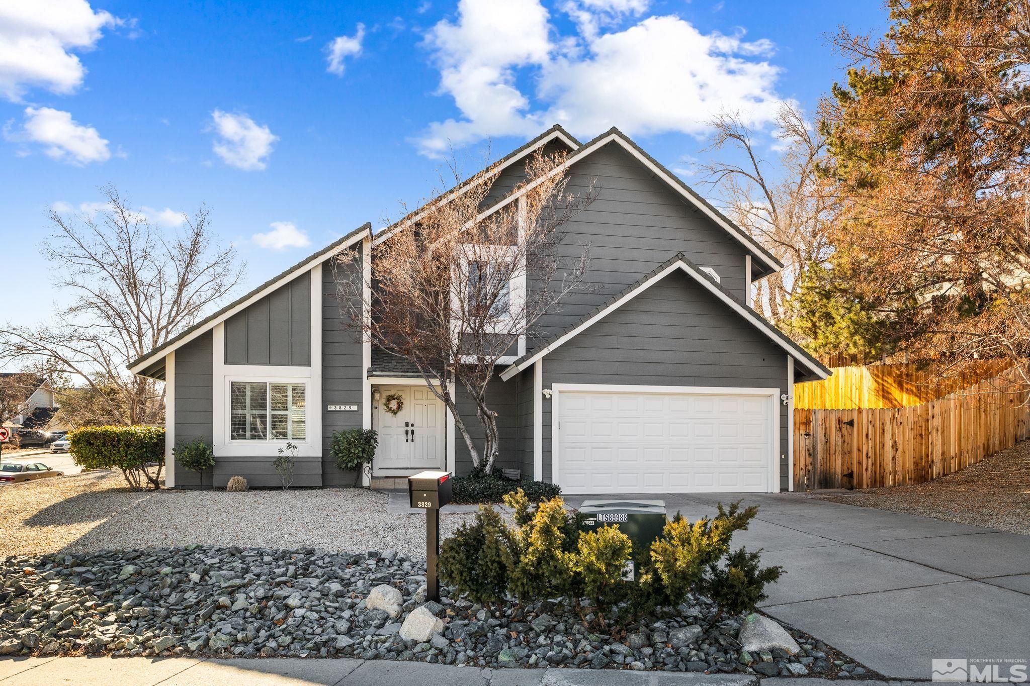 3829 Kings Row Reno, NV 89503 - Photo 1 of 40 a front view of a house with garden
