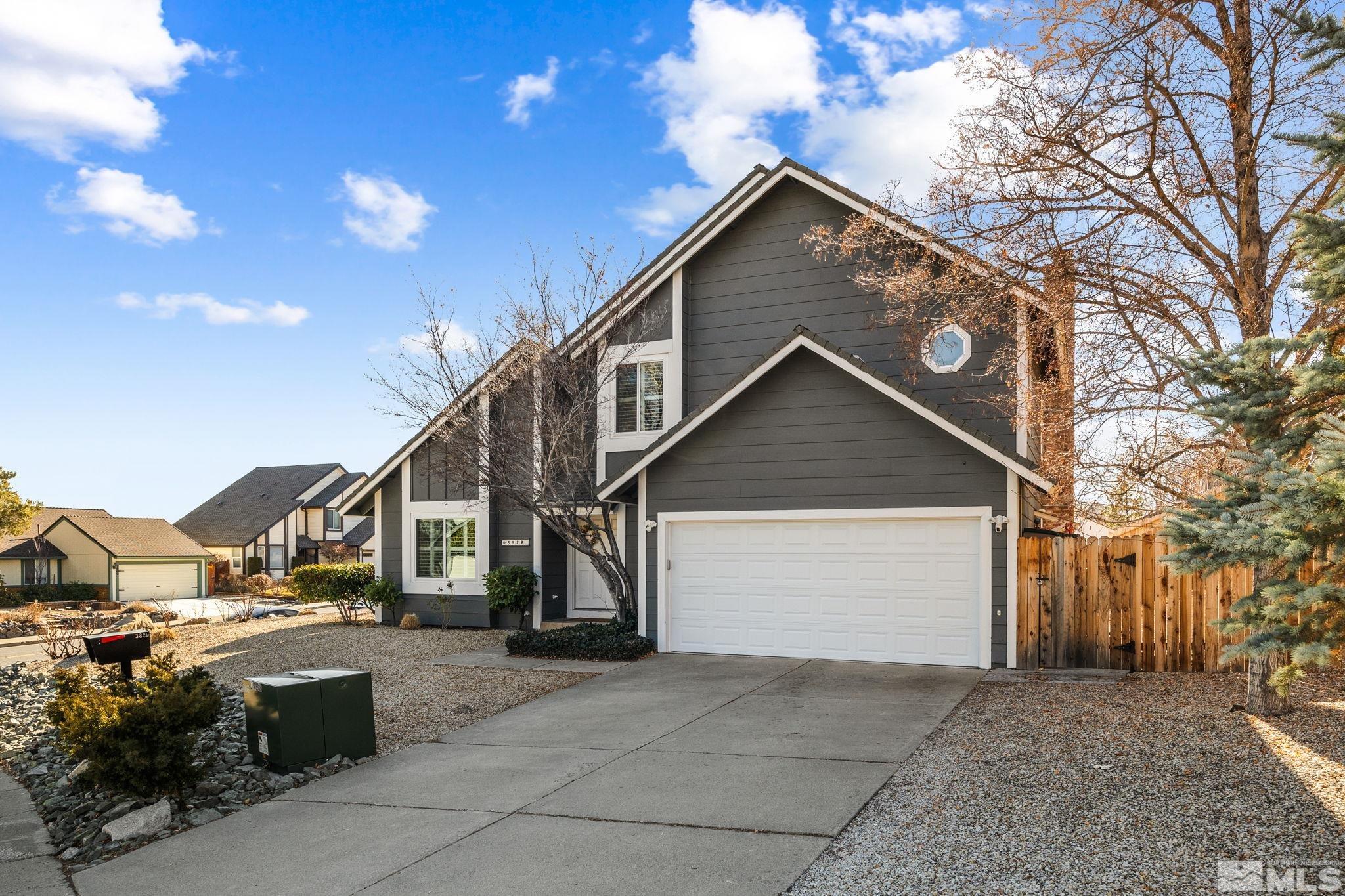3829 Kings Row Reno, NV 89503 - Photo 2 of 40 a front view of a house with a yard