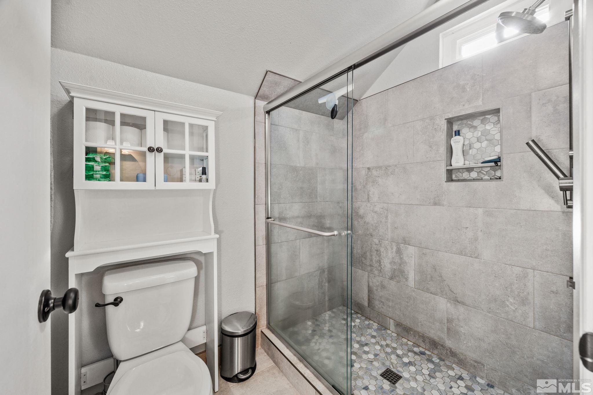 3829 Kings Row Reno, NV 89503 - Photo 29 of 40 a bathroom with a shower and toilet