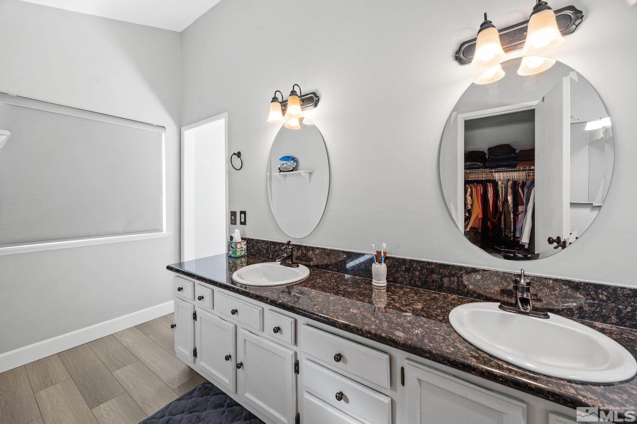 3829 Kings Row Reno, NV 89503 - Photo 30 of 40 a bathroom with double vanity sinks and a mirror