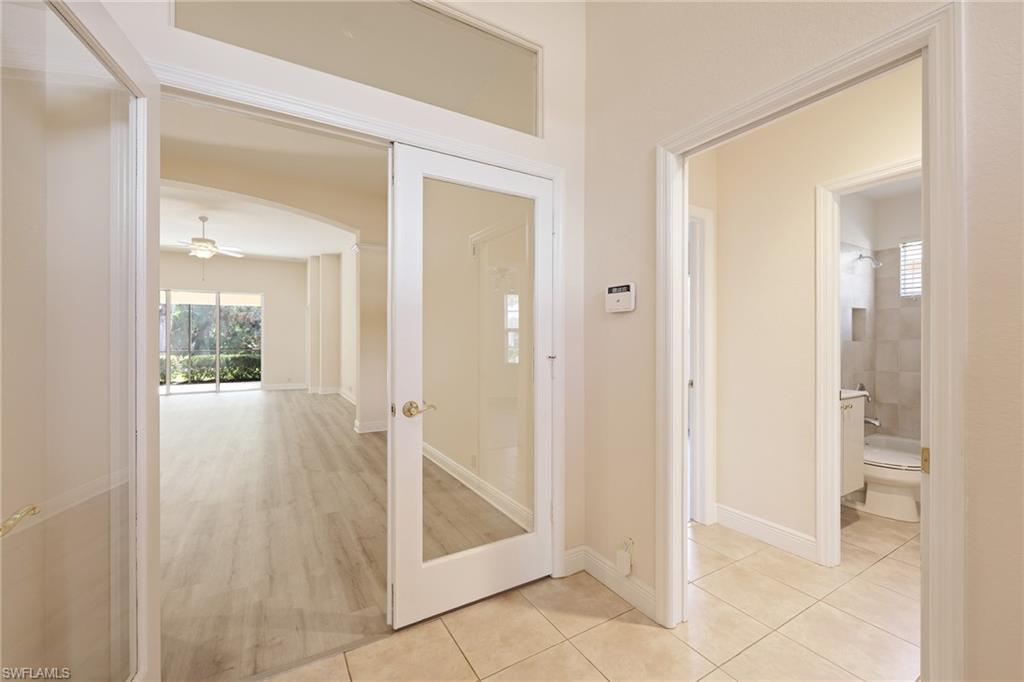 20411 Rookery Drive Estero, FL 33928 - Photo 12 of 29 large foyer with french doors light hardwood / wood-style floors