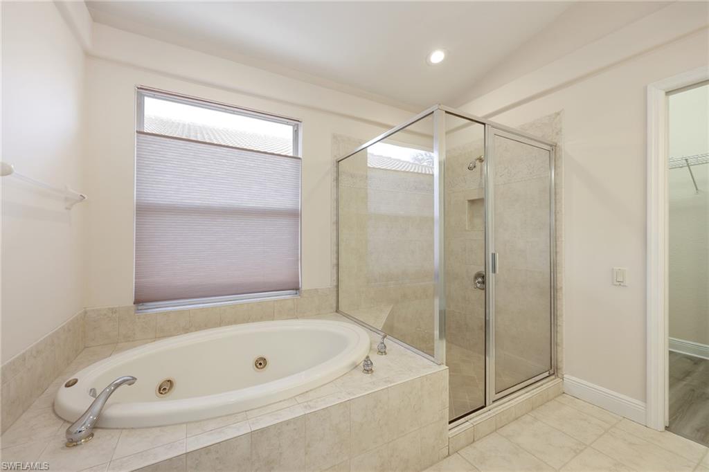 20411 Rookery Drive Estero, FL 33928 - Photo 10 of 29 Bathroom featuring tile patterned floors and shower with separate bathtub