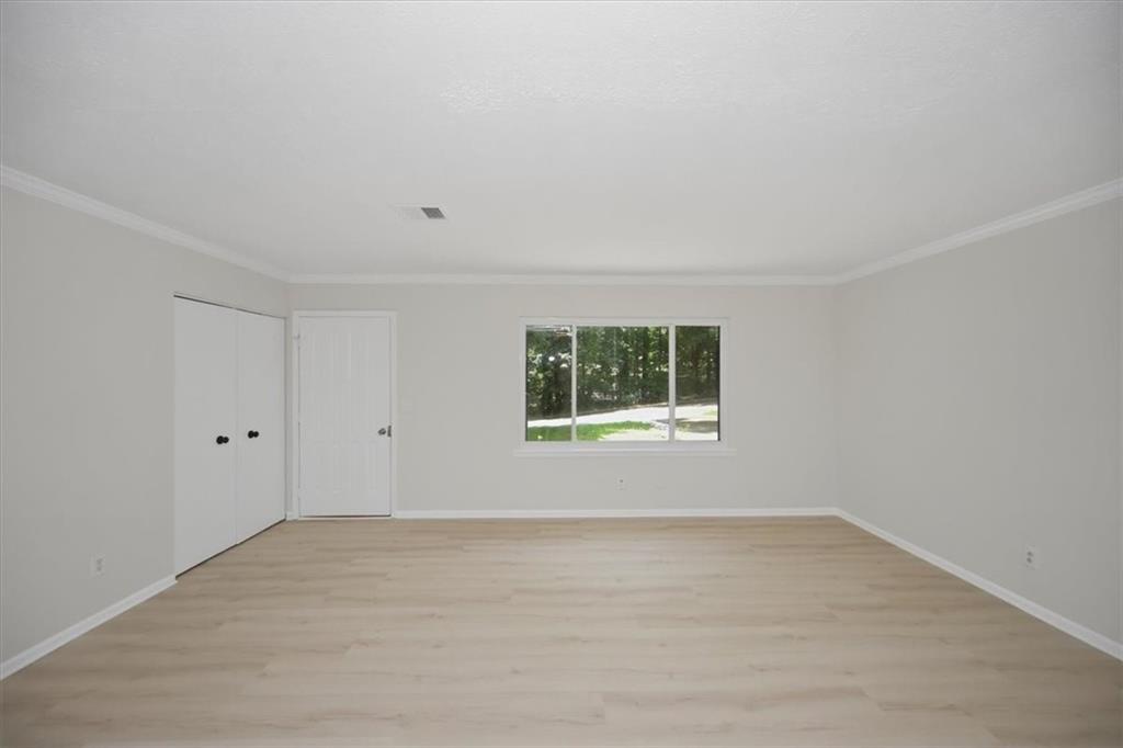 142 Deer Run Canton, GA 30114 - Photo 11 of 24 a view of an empty room with a window