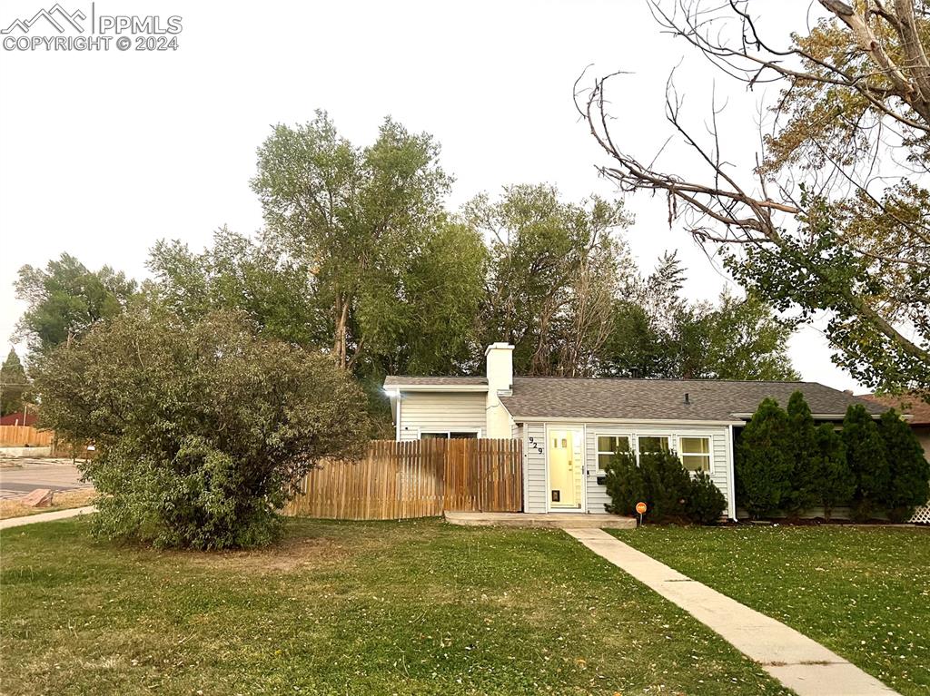 929 Sunset Road Colorado Springs, CO 80909 - Photo 2 of 45 a view of a house with a yard