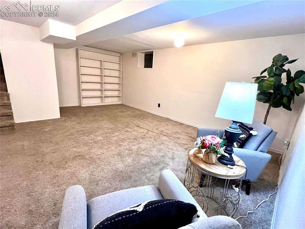 929 Sunset Road Colorado Springs, CO 80909 - Photo 39 of 45 a living room with furniture and flowers