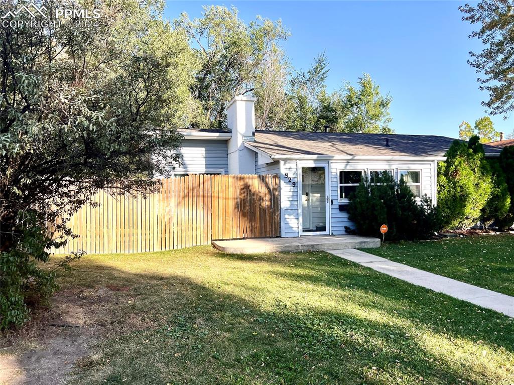 929 Sunset Road Colorado Springs, CO 80909 - Photo 4 of 45 a view of a house with a yard and potted plants