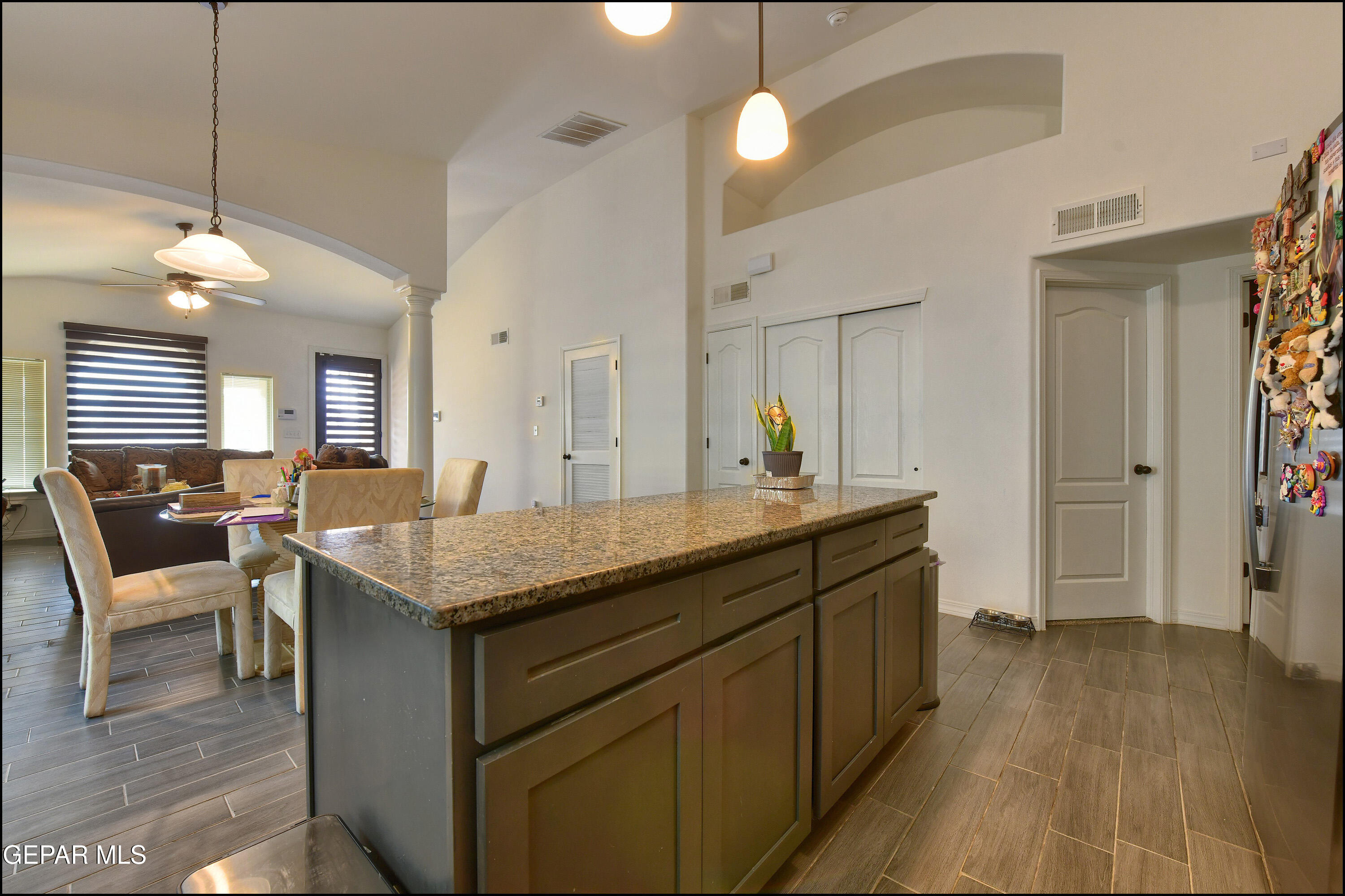 235 Herts Way El Paso, TX 79928 - Photo 13 of 35 a kitchen with granite countertop a sink cabinets and wooden floor