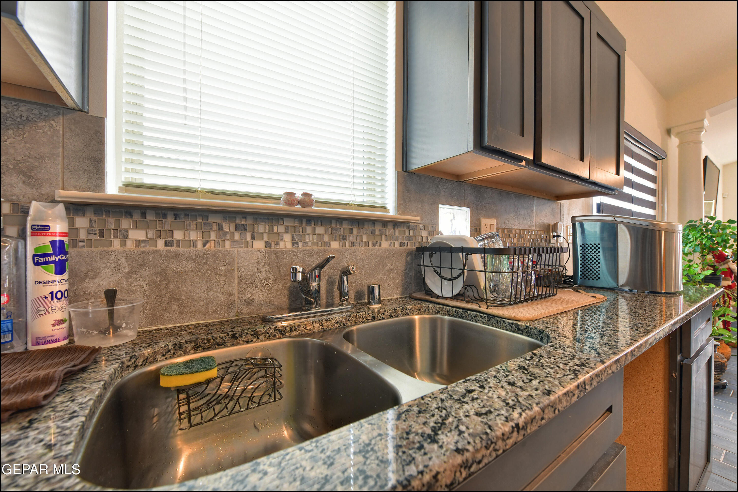235 Herts Way El Paso, TX 79928 - Photo 15 of 35 a kitchen sink with granite countertop a sink and cabinets