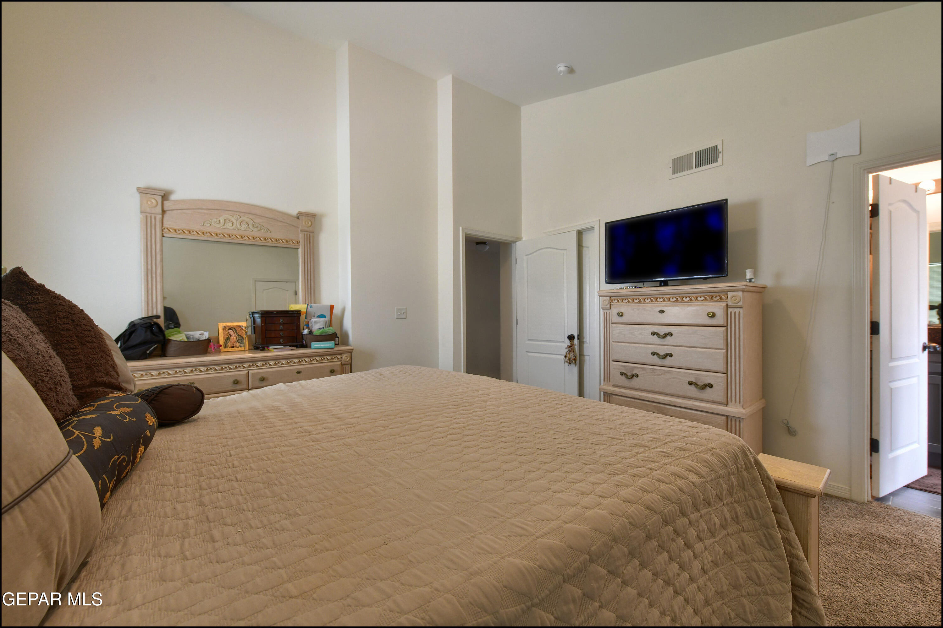 235 Herts Way El Paso, TX 79928 - Photo 18 of 35 a bedroom with a bed and a television