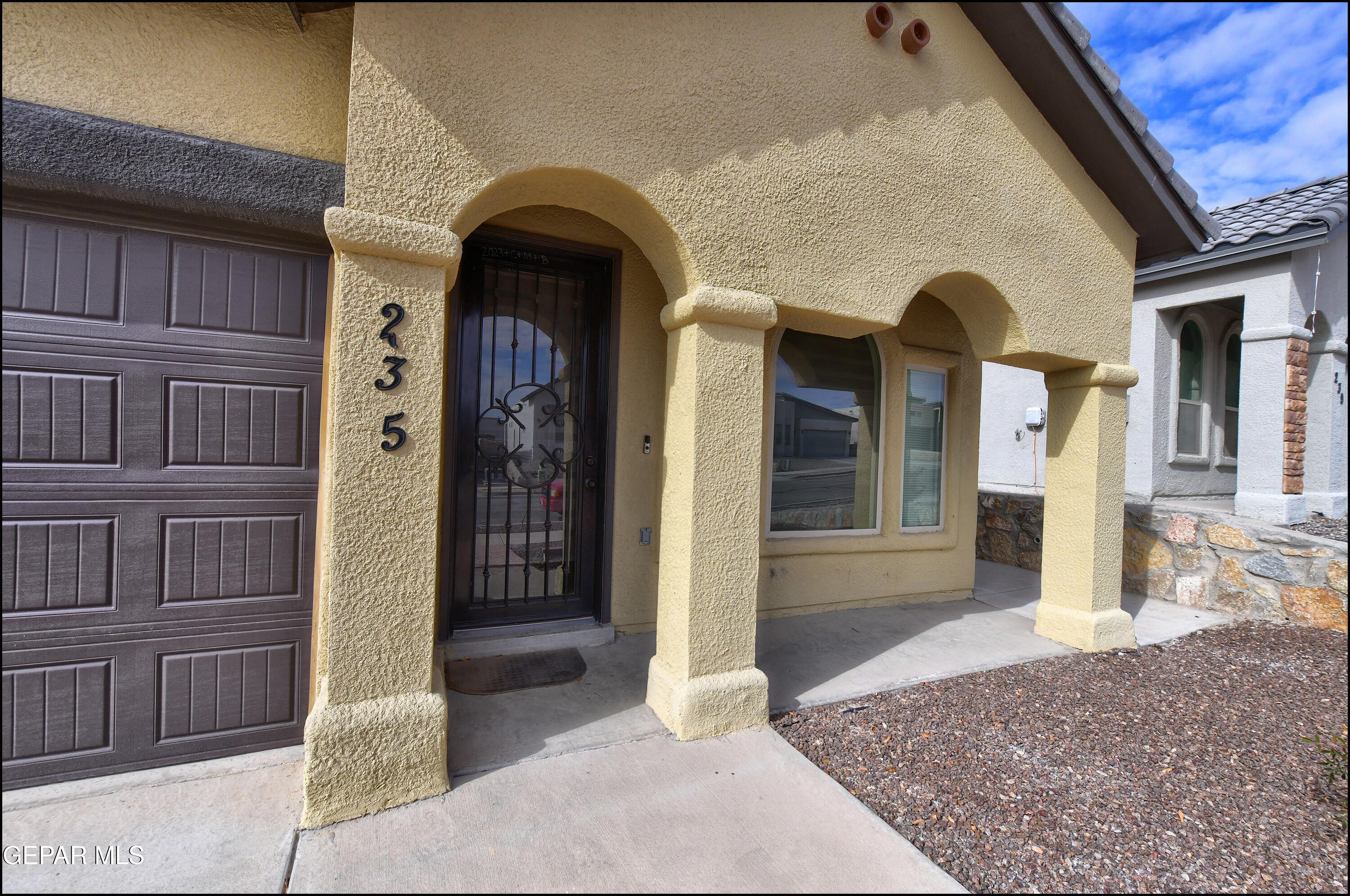 235 Herts Way El Paso, TX 79928 - Photo 3 of 35 a front view of a house with a porch