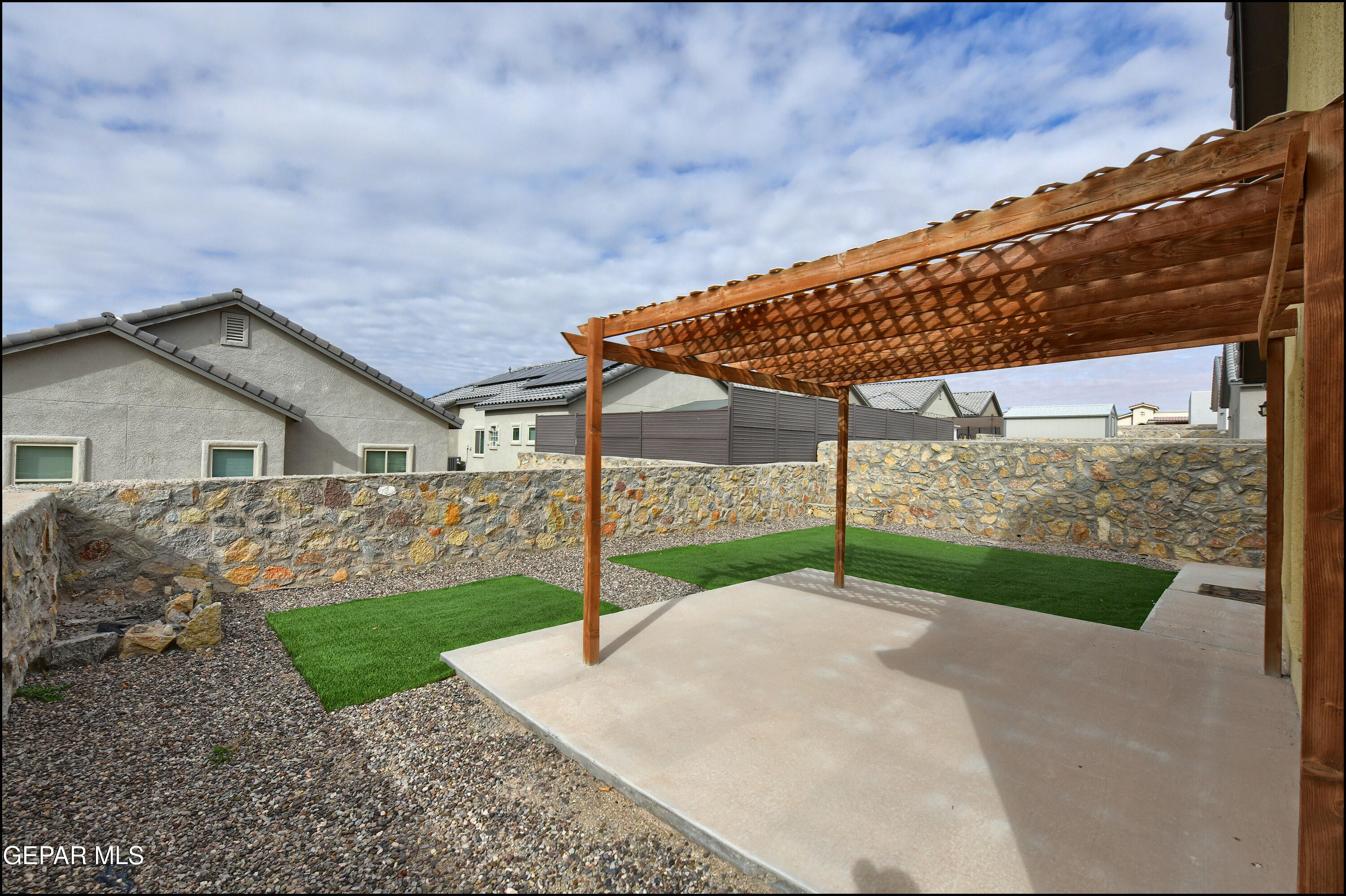 235 Herts Way El Paso, TX 79928 - Photo 33 of 35 a backyard of a house with table and chairs