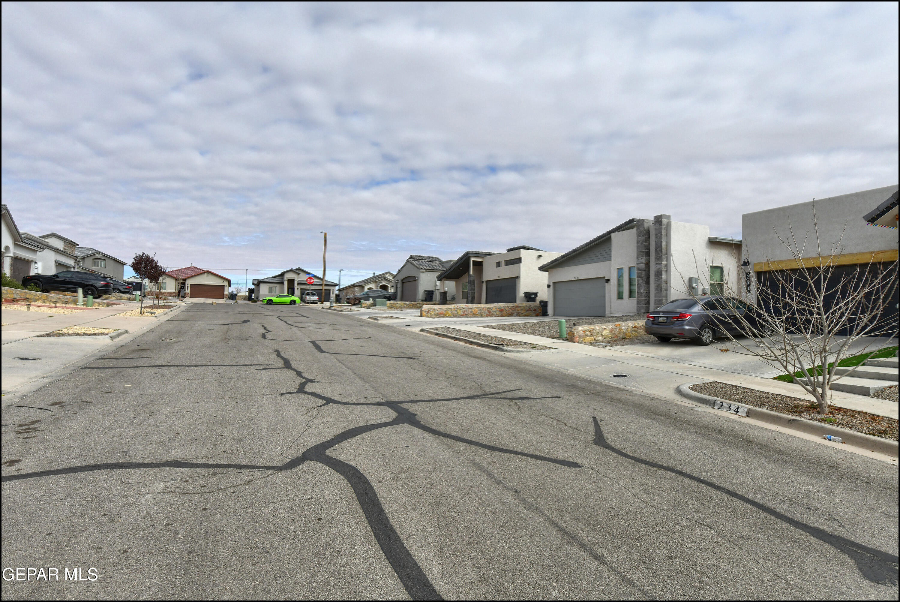 235 Herts Way El Paso, TX 79928 - Photo 34 of 35 a view of car parked on the roadside