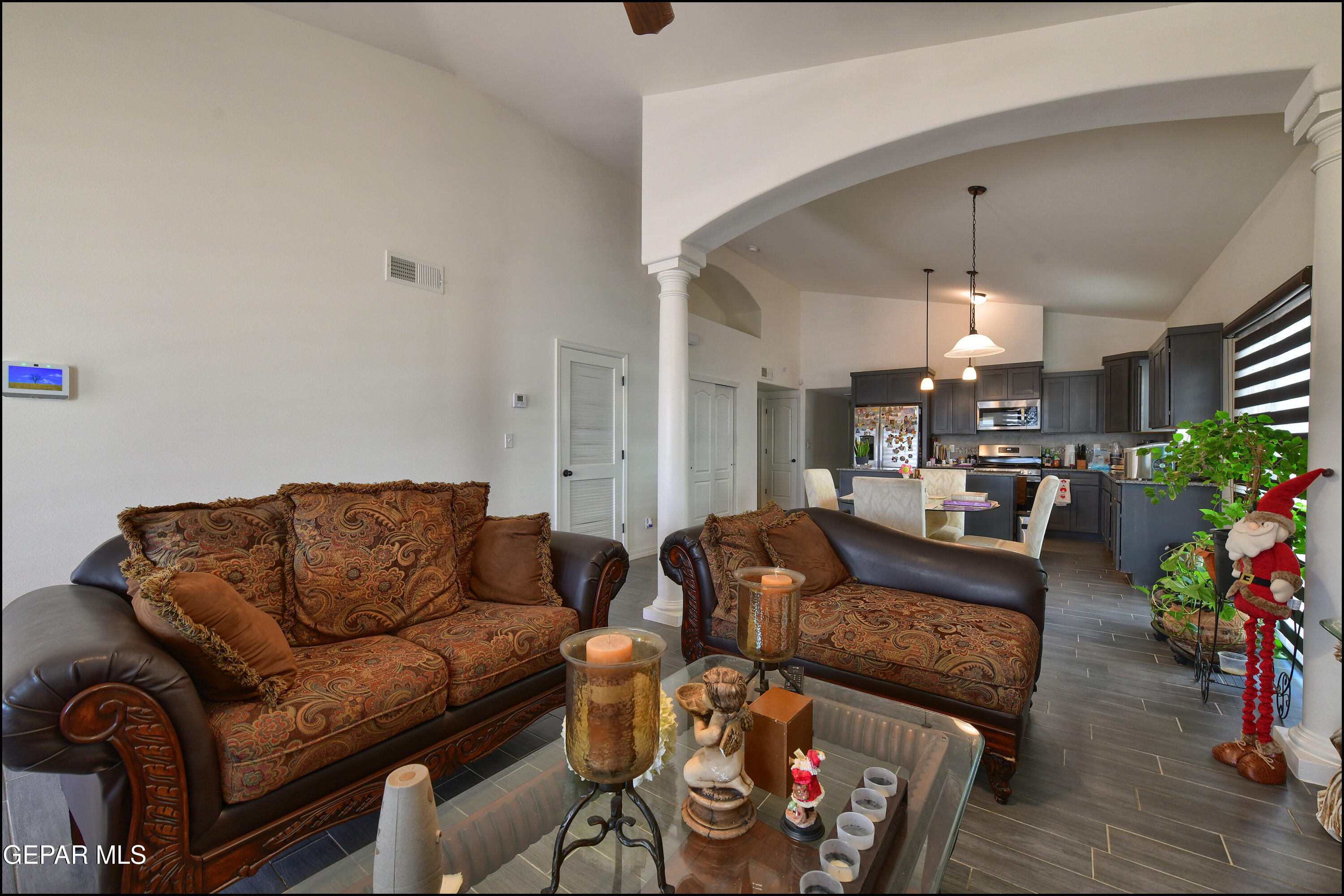 235 Herts Way El Paso, TX 79928 - Photo 5 of 35 a living room with furniture and a chandelier