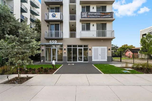 a view of a building with a yard