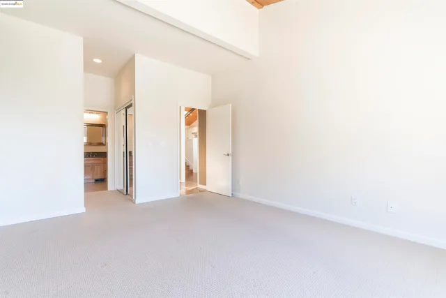 a bathroom with a sink a toilet a mirror and shower