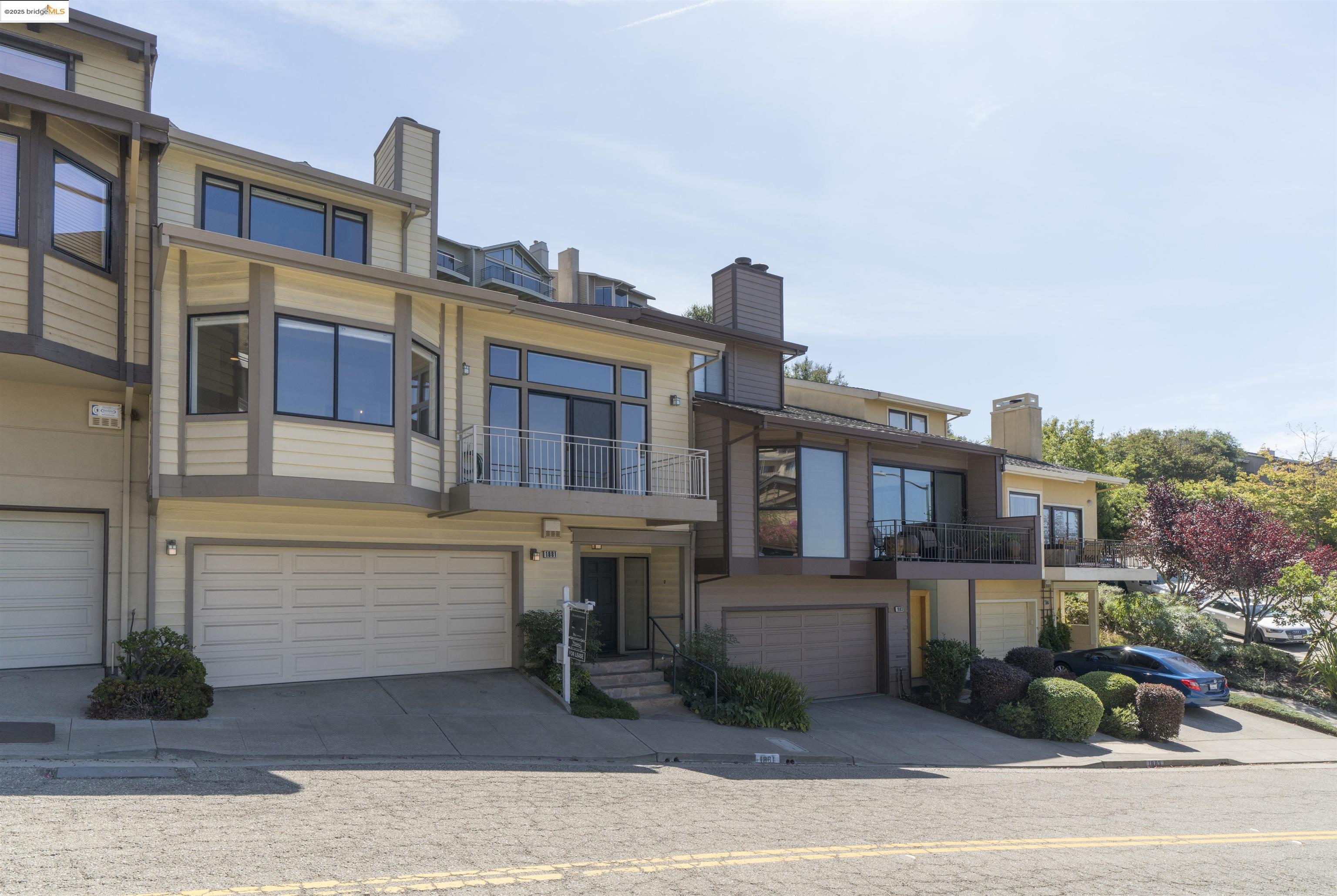 1881 Grand View Drive Oakland, CA 94618 - Photo 3 of 54 a front view of a house with a garden