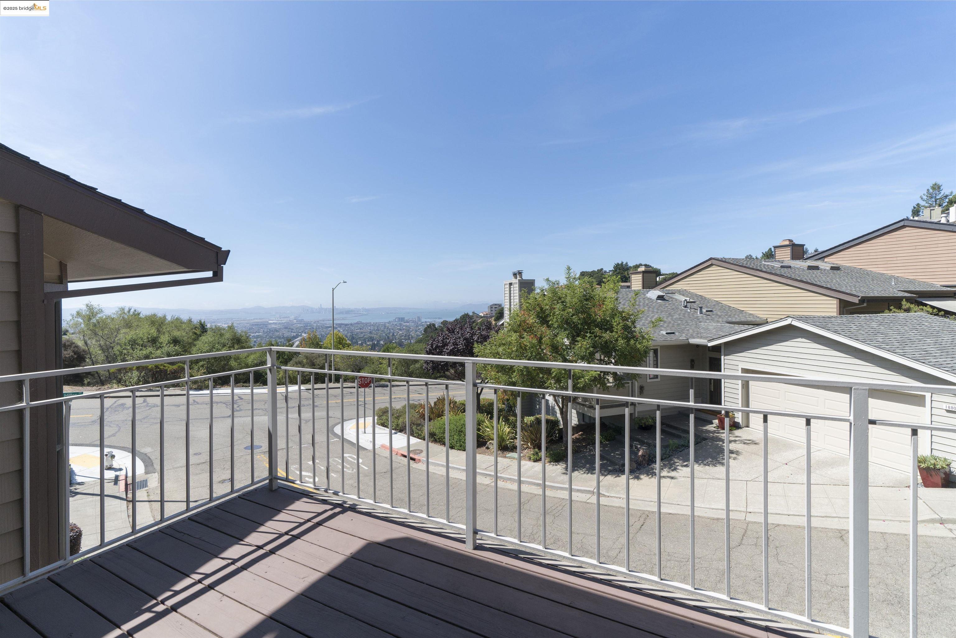 1881 Grand View Drive Oakland, CA 94618 - Photo 35 of 54 a view of a roof deck with wooden floor and fence
