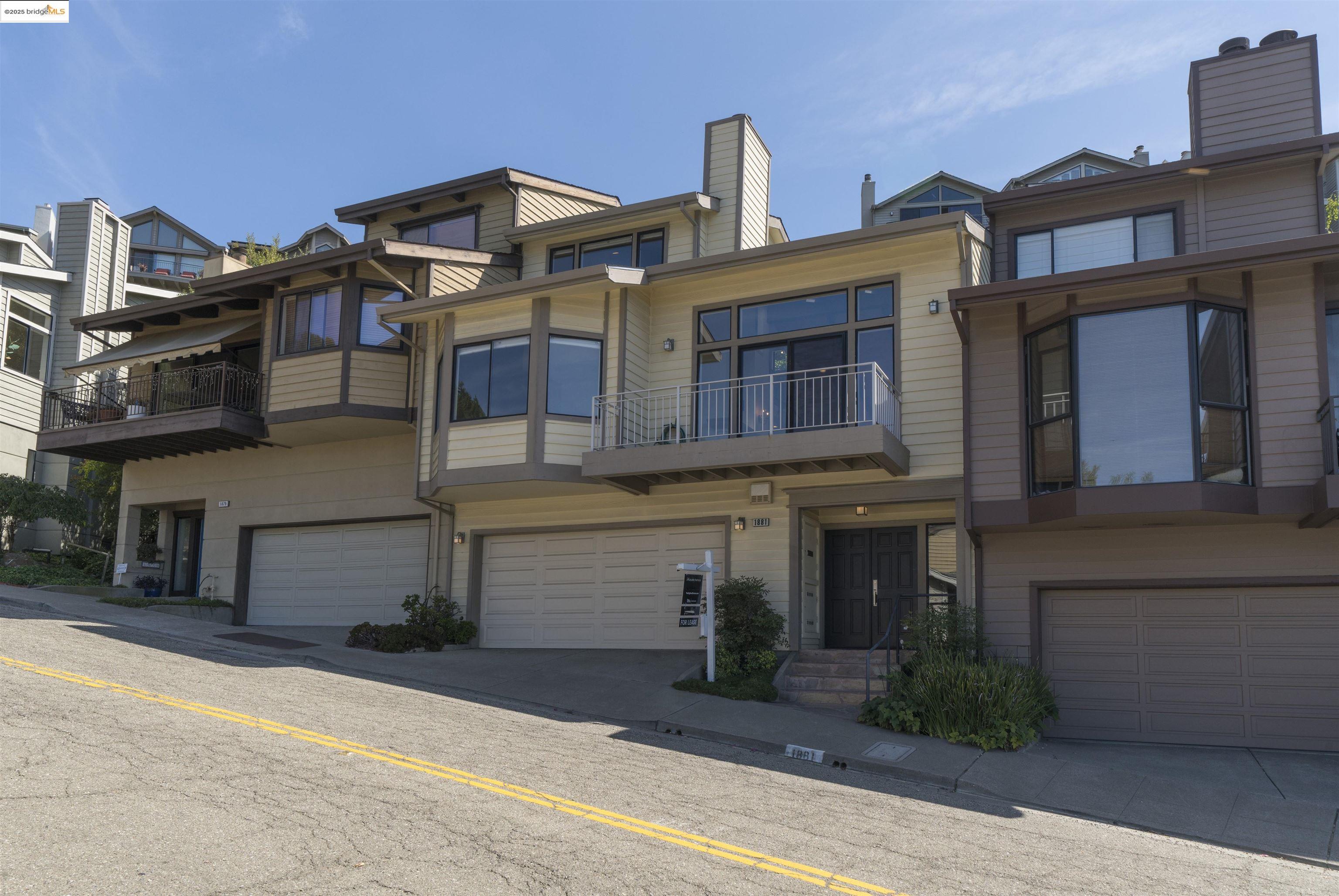 1881 Grand View Drive Oakland, CA 94618 - Photo 4 of 54 a front view of a house with a yard