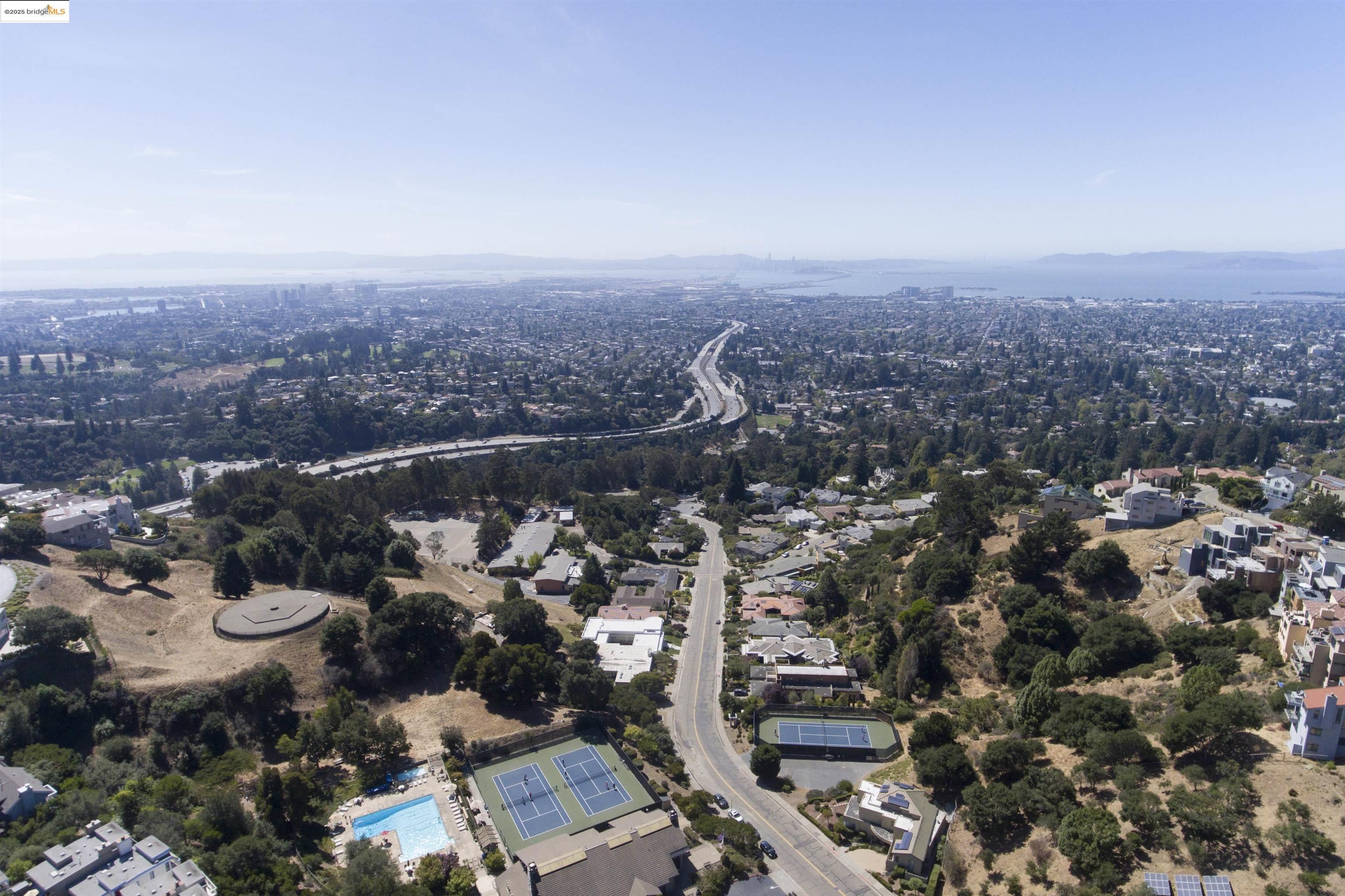 1881 Grand View Drive Oakland, CA 94618 - Photo 43 of 54 an aerial view of a city with lots of residential buildings