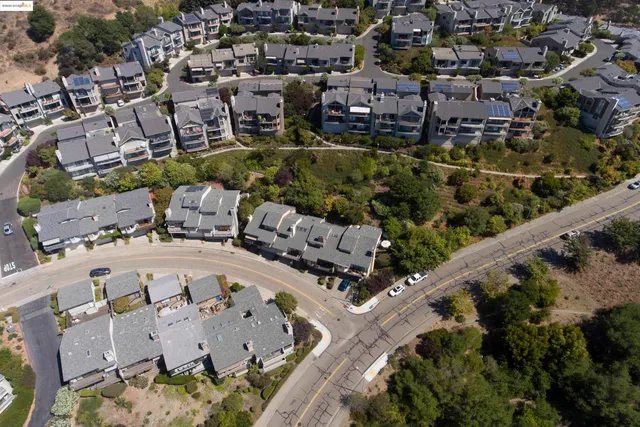 a aerial view of a house with a yard and sitting area