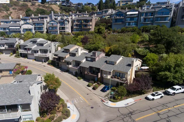 a aerial view of a house with a yard and sitting area