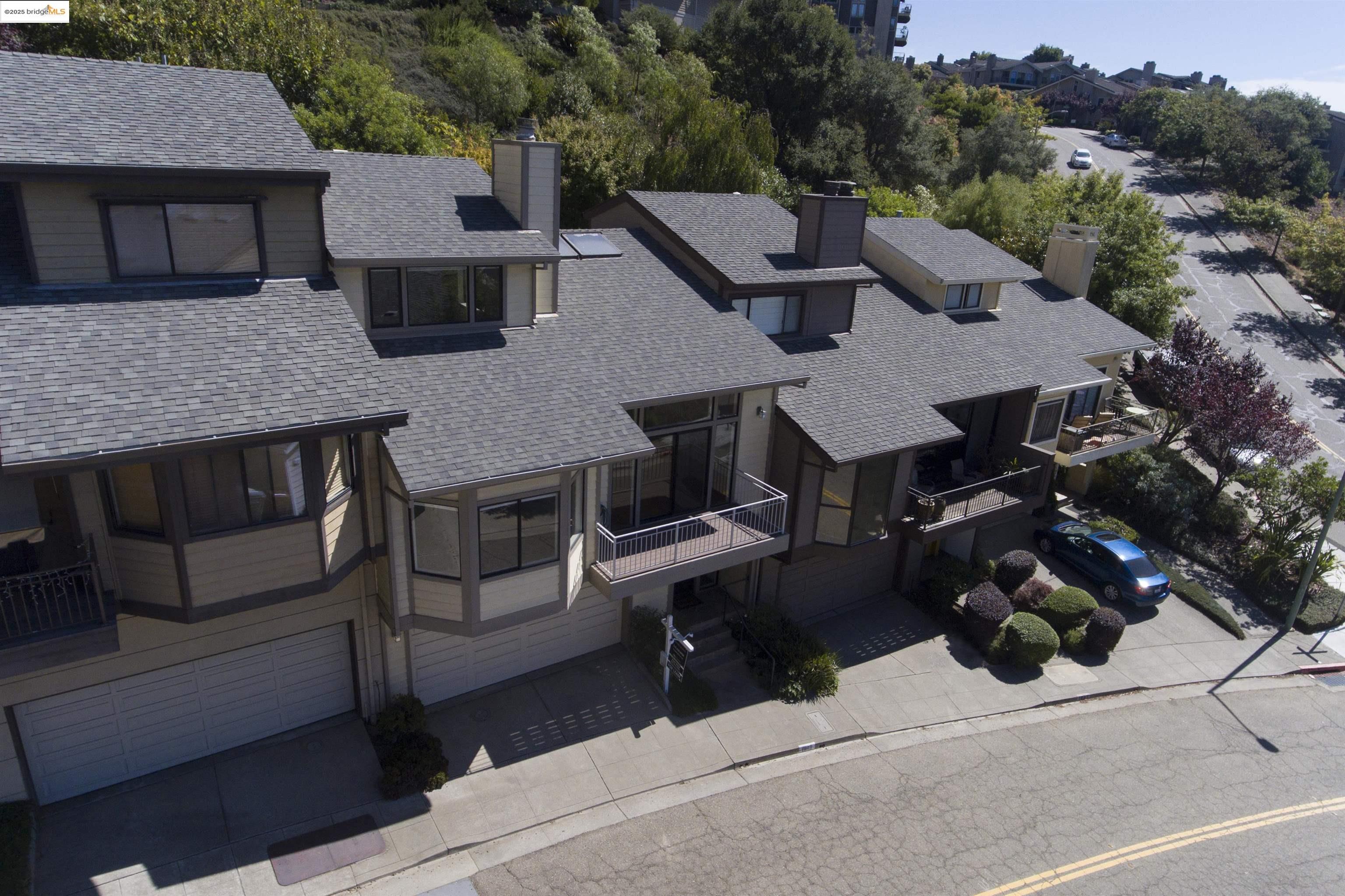 1881 Grand View Drive Oakland, CA 94618 - Photo 53 of 54 a aerial view of a house with a yard and sitting area