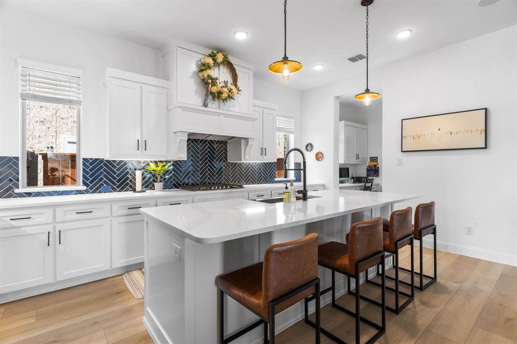 1898 Tumblegrass Road Frisco, TX 75033 - Photo 14 of 40 a kitchen with a sink cabinets and window