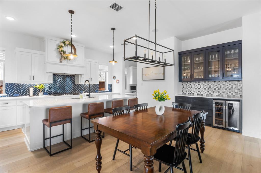 1898 Tumblegrass Road Frisco, TX 75033 - Photo 15 of 40 a view of kitchen and dining area with furniture