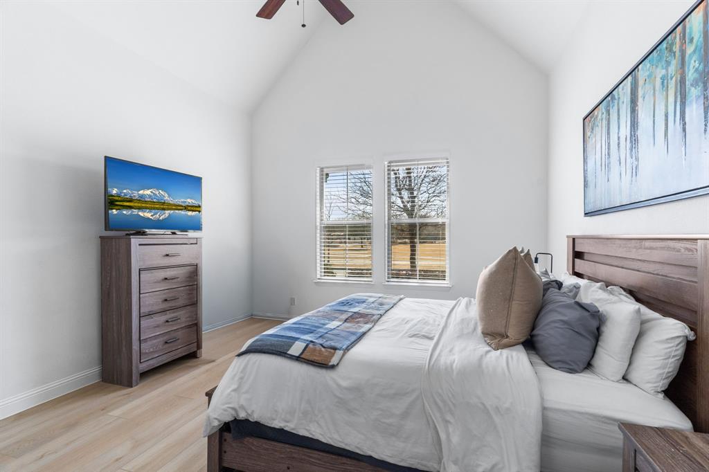 1898 Tumblegrass Road Frisco, TX 75033 - Photo 19 of 40 a bedroom with a bed and a window