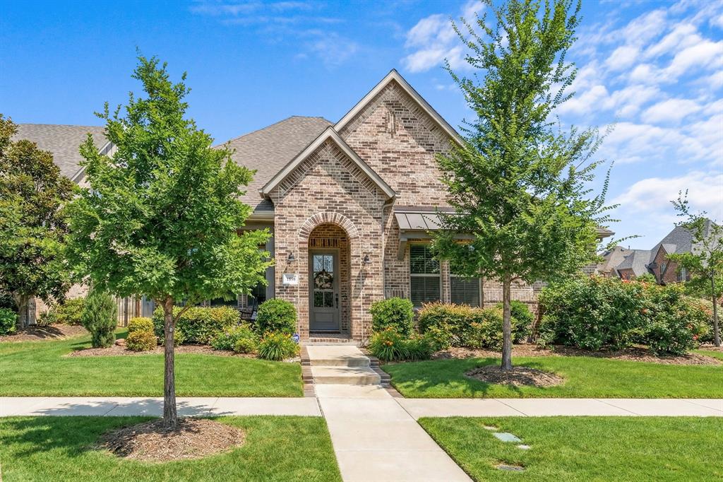 1898 Tumblegrass Road Frisco, TX 75033 - Photo 30 of 40 a front view of a house with a yard