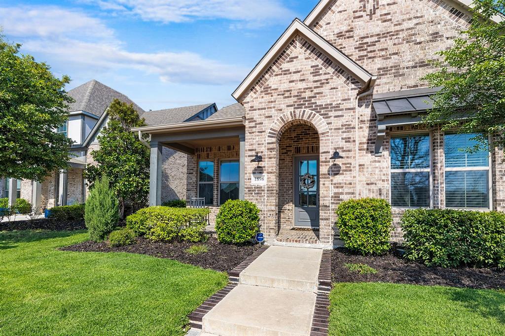 1898 Tumblegrass Road Frisco, TX 75033 - Photo 32 of 40 front view of a house with a yard