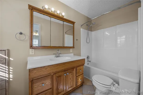 a bathroom with a bathtub and window