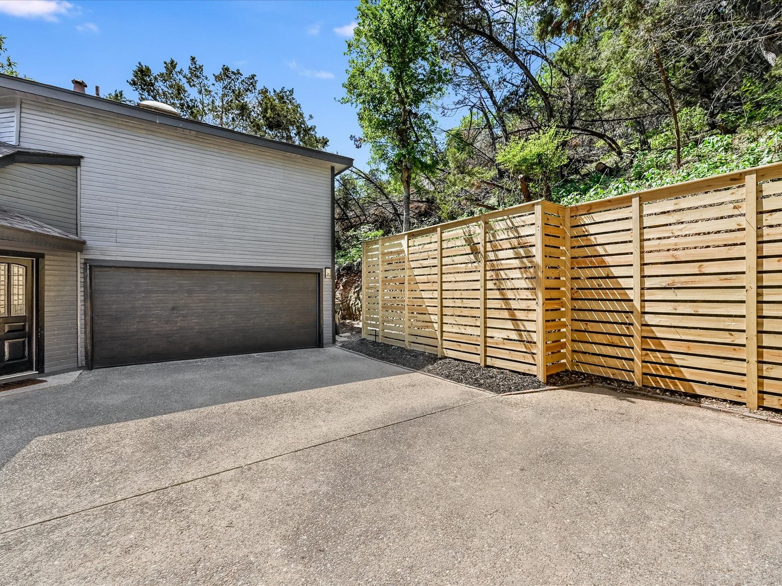 2712 Geronimo Trail Austin, TX 78734 - Photo 26 of 31 a front view of a house with a garage