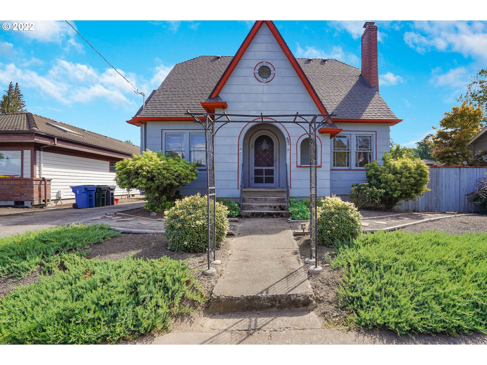 a front view of a house with garden