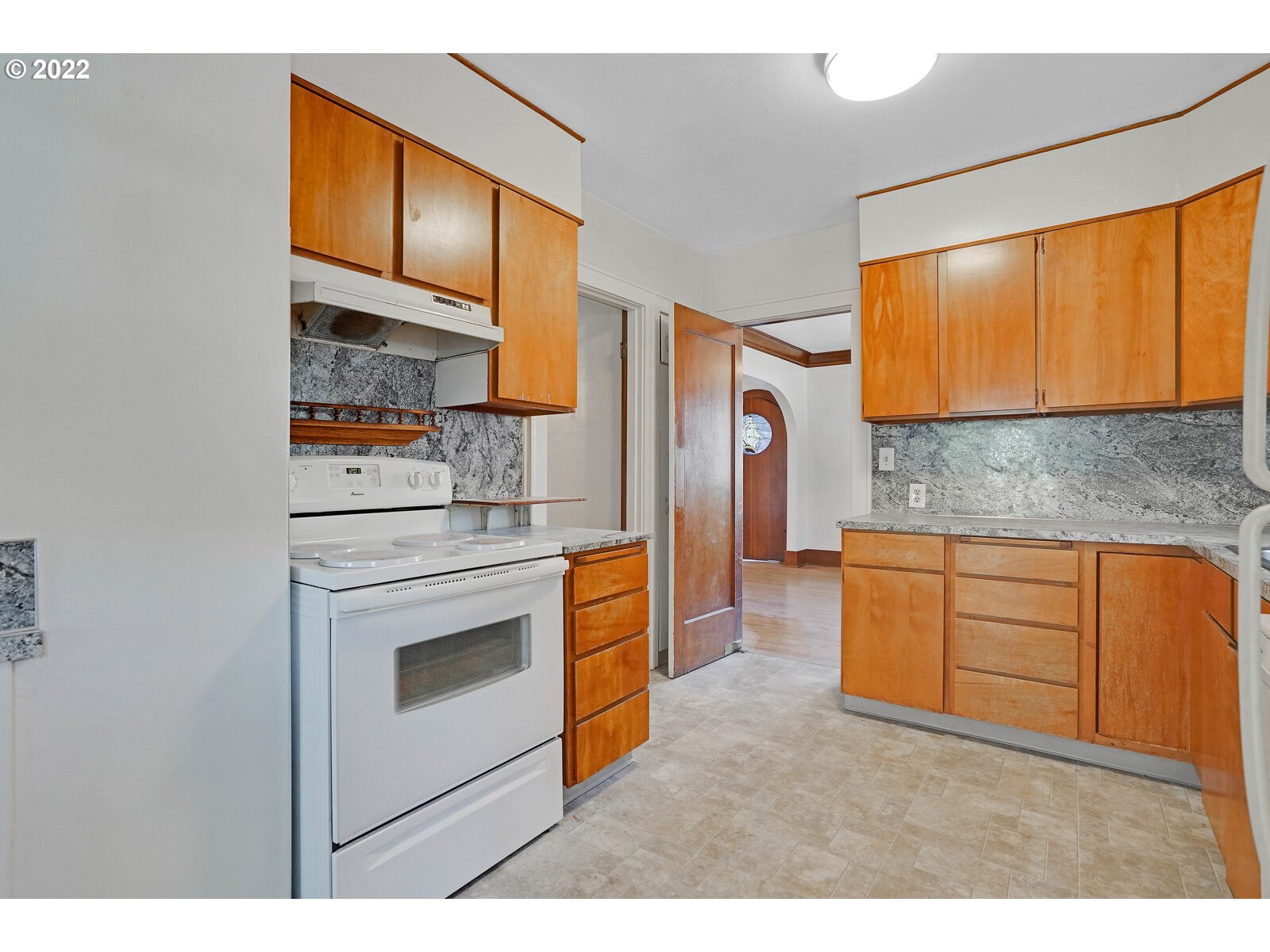 440 17th Street Northeast Salem, OR 97301 - Photo 15 of 32 a kitchen with stainless steel appliances granite countertop a stove a sink and a refrigerator