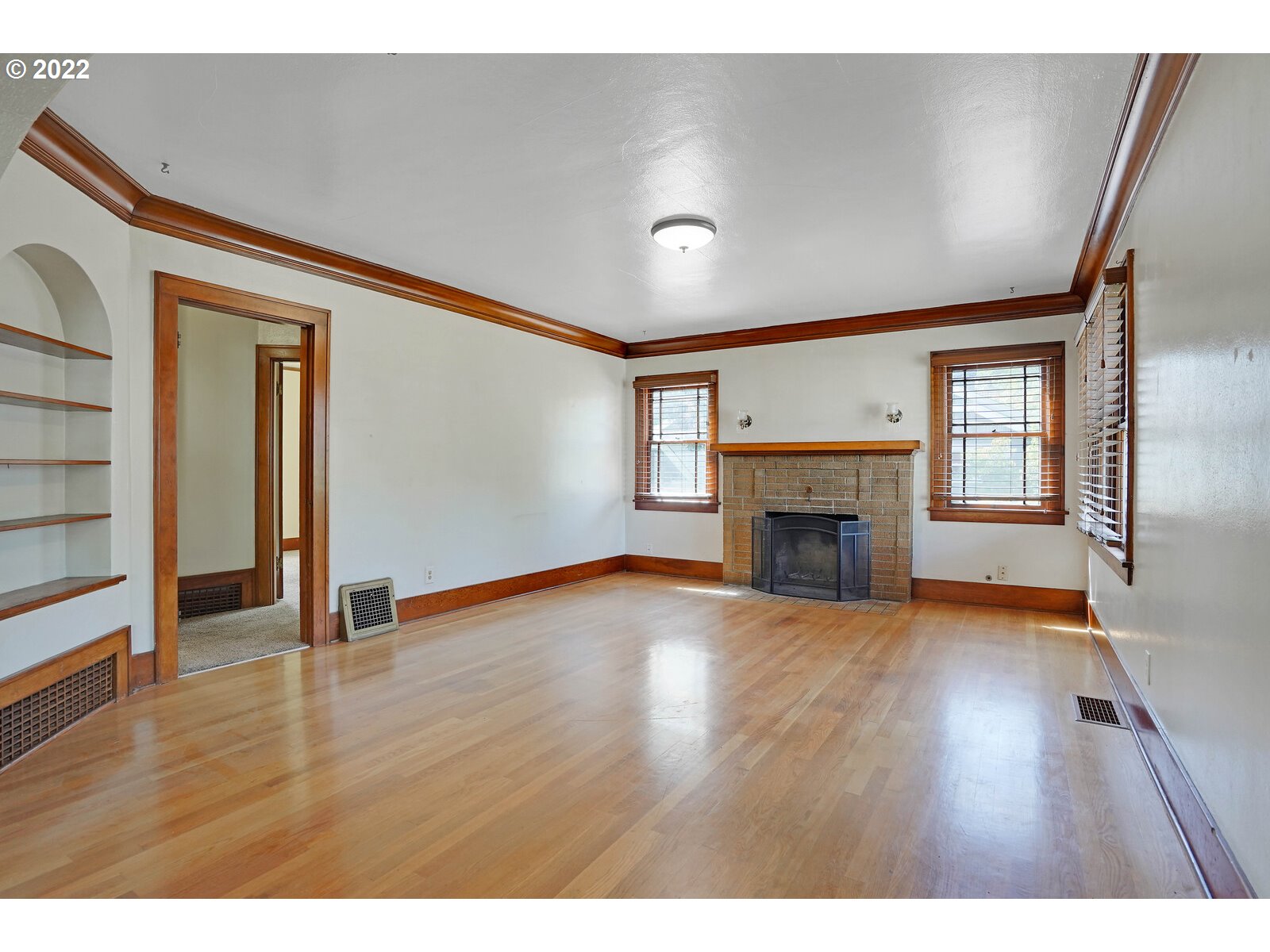 440 17th Street Northeast Salem, OR 97301 - Photo 21 of 32 a view of empty room with wooden floor and fireplace
