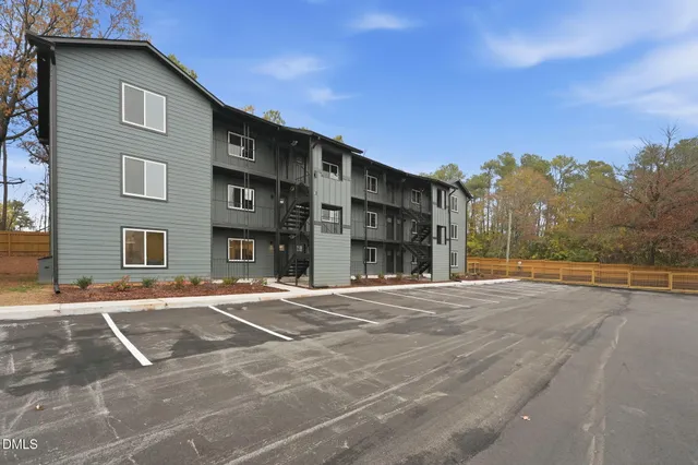 a view of a building with a road