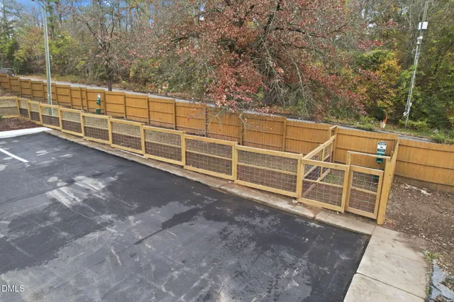 a view of a garage with wooden fence