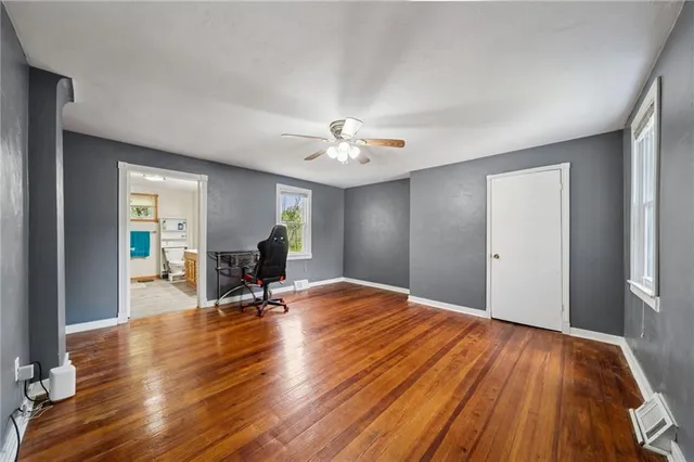 a view of a livingroom with wooden floor