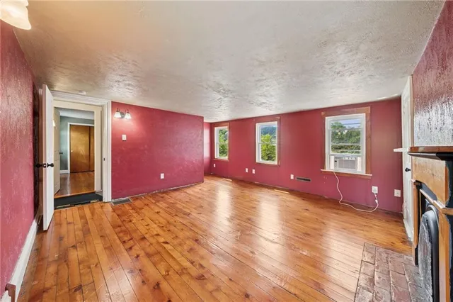 a view of a livingroom with furniture hardwood floor and staircase