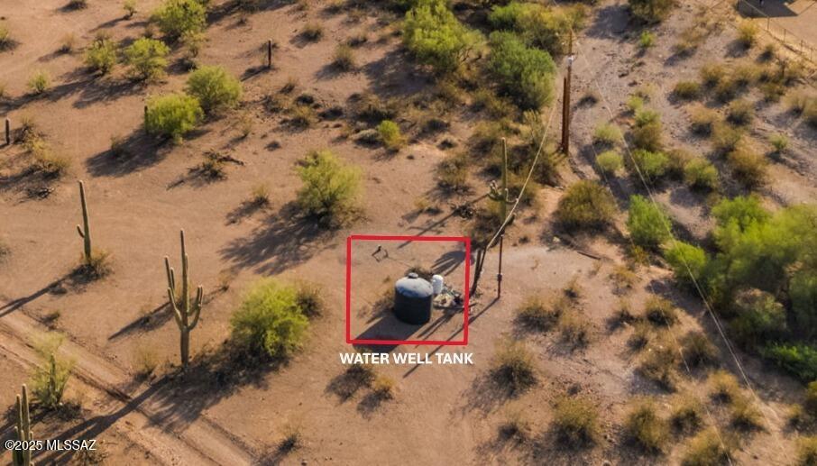 7759 North Artesiano Road, Unit 2 Tucson, AZ 85743 - Photo 33 of 33 an aerial view of a house with a yard and large tree