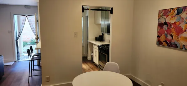 a bathroom with a toilet and a shower curtain